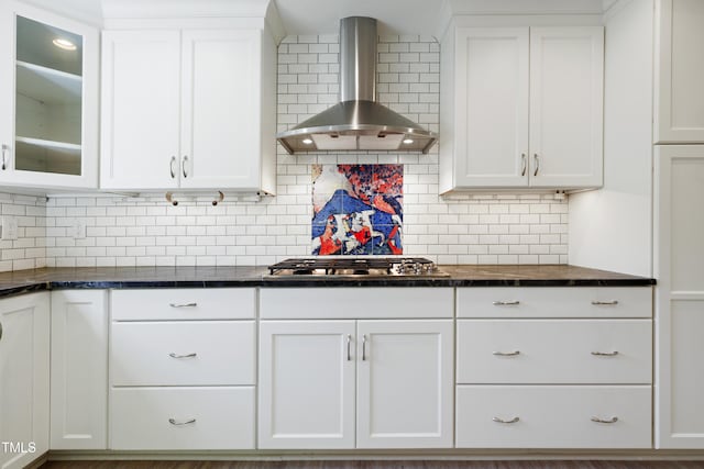 712 Beaver Dam Rd, Raleigh, NC 27607 - kitchen with wall chimney exhaust hood, stainless steel gas stovetop, white cabinets, and glass insert cabinets