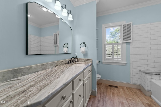 5308 Stableview Ct, Holly Springs, NC 27540 - bathroom with vanity, wood finished floors, ornamental molding, a shower, and a tub