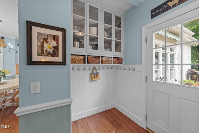 5308 Stableview Ct, Holly Springs, NC 27540 - doorway to outside featuring wood finished floors and a wainscoted wall