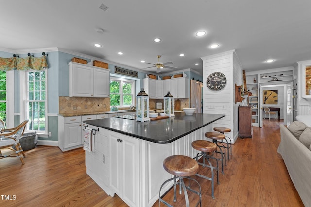 5308 Stableview Ct, Holly Springs, NC 27540 - kitchen featuring white cabinetry, ceiling fan, light wood-style flooring, recessed lighting, and ornamental molding