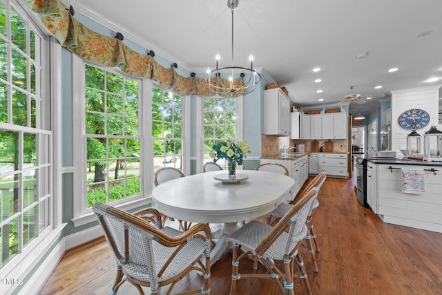 5308 Stableview Ct, Holly Springs, NC 27540 - dining room featuring healthy amount of natural light, recessed lighting, wood finished floors, a chandelier, and a ceiling fan