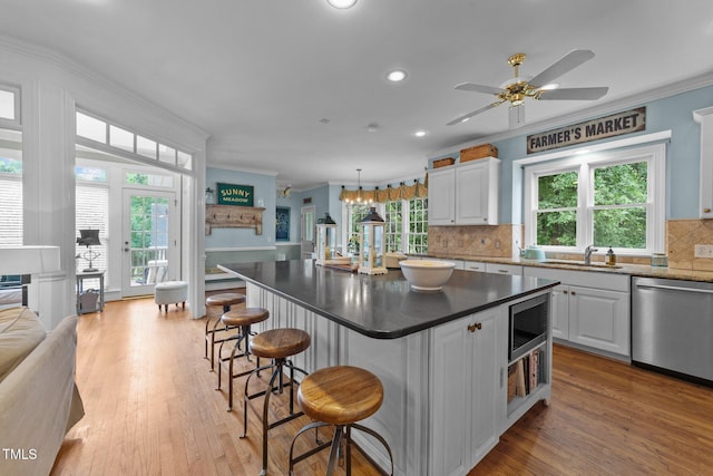 5308 Stableview Ct, Holly Springs, NC 27540 - kitchen featuring stainless steel appliances, ornamental molding, white cabinets, decorative backsplash, and recessed lighting