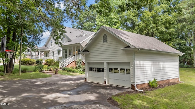 5308 Stableview Ct, Holly Springs, NC 27540 - view of home's exterior featuring a yard, a shingled roof, and a garage