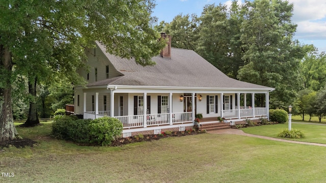 5308 Stableview Ct, Holly Springs, NC 27540 - farmhouse-style home with a porch, a shingled roof, a front lawn, and a chimney