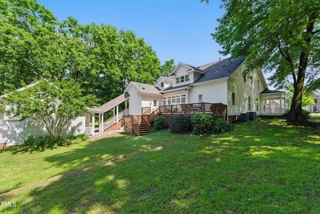 5308 Stableview Ct, Holly Springs, NC 27540 - rear view of house with a wooden deck, stairs, and a yard