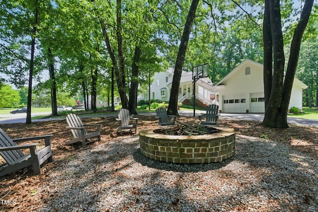 5308 Stableview Ct, Holly Springs, NC 27540 - view of yard with a garage and an outdoor fire pit