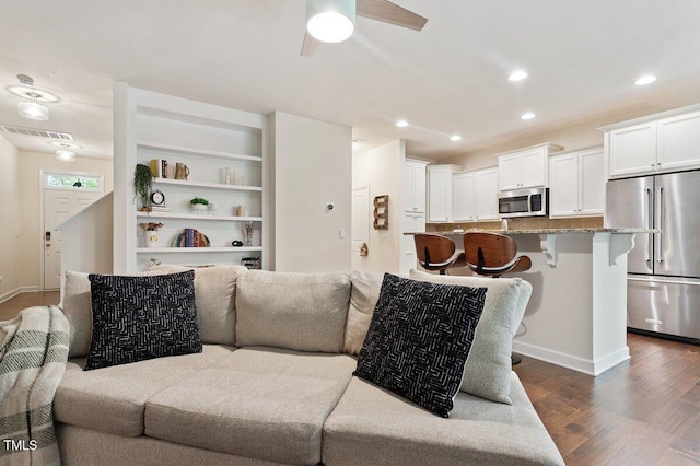 270 Wembley Dr, Clayton, NC 27527 - living area with dark wood-style floors, recessed lighting, a ceiling fan, and baseboards