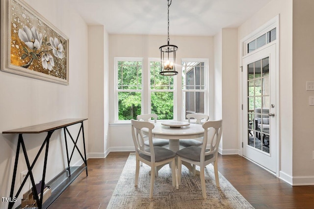 270 Wembley Dr, Clayton, NC 27527 - dining space with dark wood-type flooring, baseboards, and a chandelier
