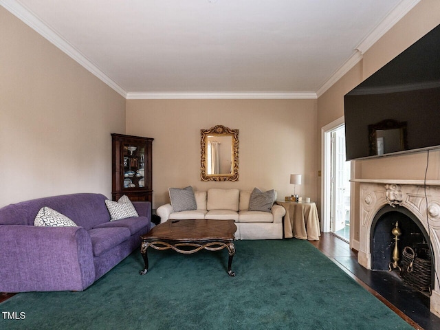 living room with crown molding and a fireplace