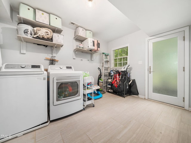 7605 Copper Mine Ln, Raleigh, NC 27615 - laundry area with washer and clothes dryer