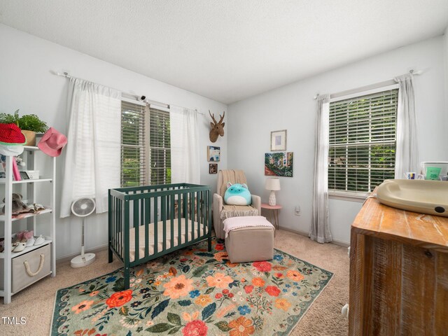 7605 Copper Mine Ln, Raleigh, NC 27615 - carpeted bedroom featuring a crib