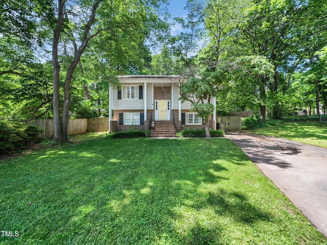 7605 Copper Mine Ln, Raleigh, NC 27615 - split foyer home with brick siding and concrete driveway