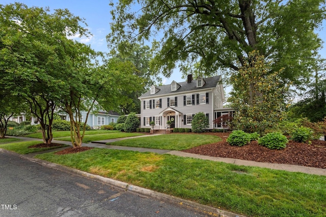 1015 Watts St, Durham, NC 27701 - colonial house with a front lawn and a chimney