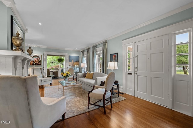 1015 Watts St, Durham, NC 27701 - living room featuring crown molding, wood finished floors, and recessed lighting