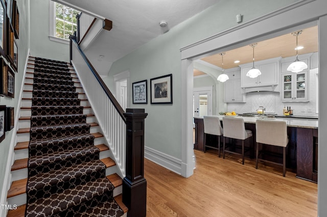 1015 Watts St, Durham, NC 27701 - stairs with wood finished floors and baseboards