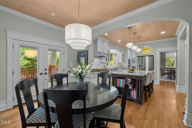 1015 Watts St, Durham, NC 27701 - dining room featuring arched walkways, wood ceiling, light wood-style flooring, ornamental molding, and recessed lighting