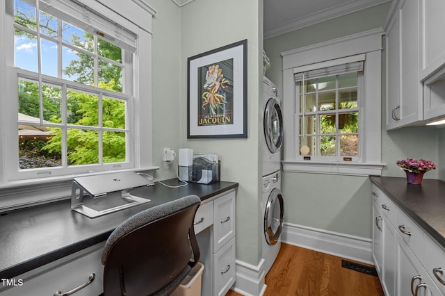 1015 Watts St, Durham, NC 27701 - office space with estacked washer and dryer, crown molding, dark wood finished floors, and baseboards