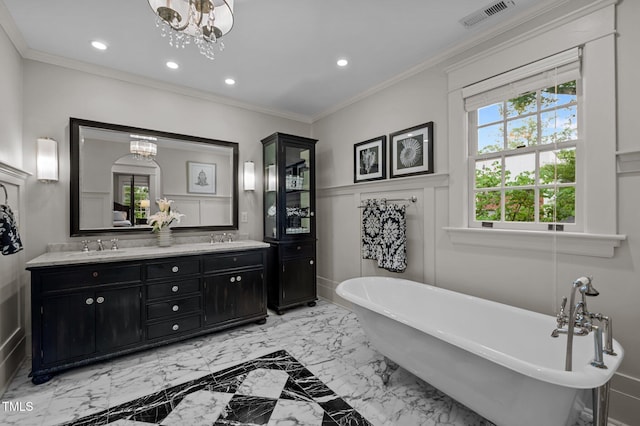 1015 Watts St, Durham, NC 27701 - full bathroom featuring a chandelier, recessed lighting, double vanity, a soaking tub, and ornamental molding