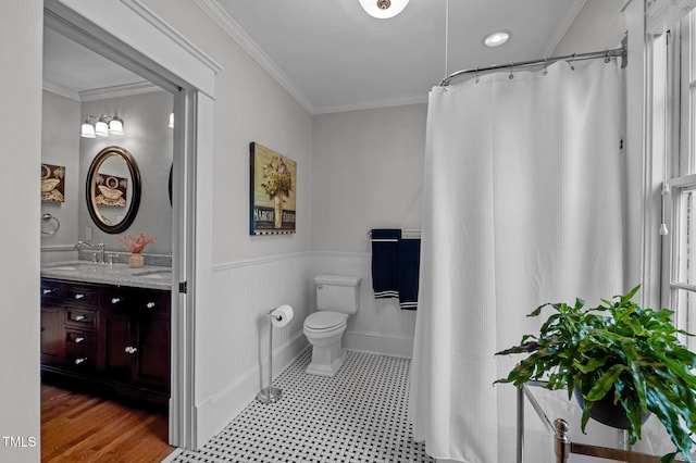 1015 Watts St, Durham, NC 27701 - full bath featuring toilet, ornamental molding, vanity, wainscoting, and curtained shower