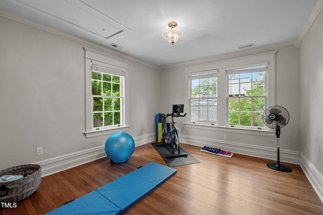 1015 Watts St, Durham, NC 27701 - workout area with healthy amount of natural light, wood finished floors, attic access, ornamental molding, and baseboards