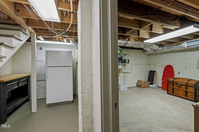 1015 Watts St, Durham, NC 27701 - unfinished basement with freestanding refrigerator and stairs