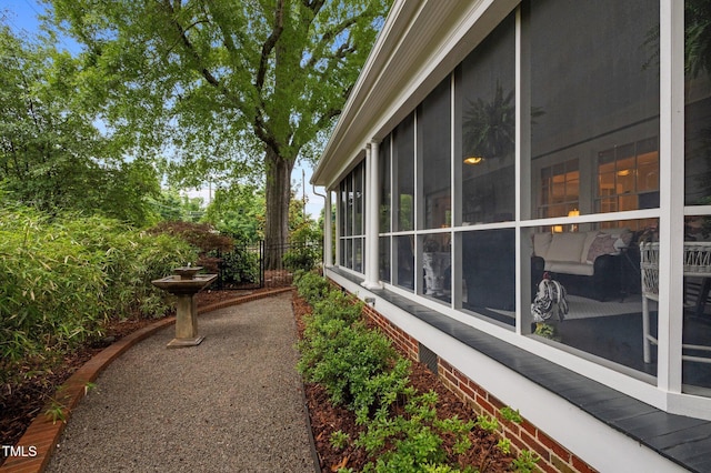 1015 Watts St, Durham, NC 27701 - view of side of property with fence and a sunroom