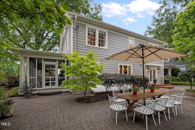 1015 Watts St, Durham, NC 27701 - view of patio / terrace with french doors, a sunroom, and outdoor dining area