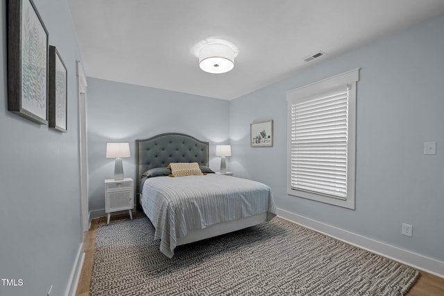 1015 Watts St, Durham, NC 27701 - bedroom featuring baseboards and wood finished floors