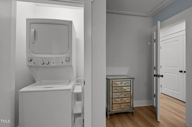 1015 Watts St, Durham, NC 27701 - laundry room featuring stacked washer / drying machine and light wood-style floors