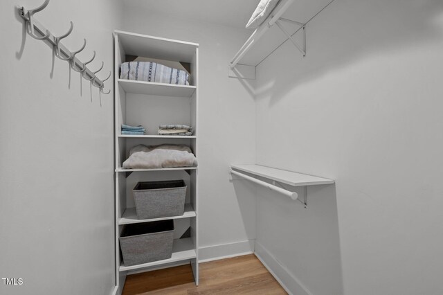1015 Watts St, Durham, NC 27701 - walk in closet with wood finished floors