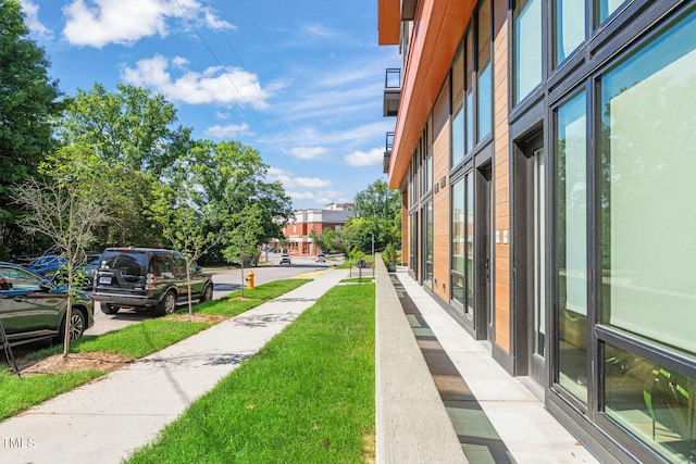 615 Daniels St Unit 215, Raleigh, NC 27605 - view of home's community with a lawn
