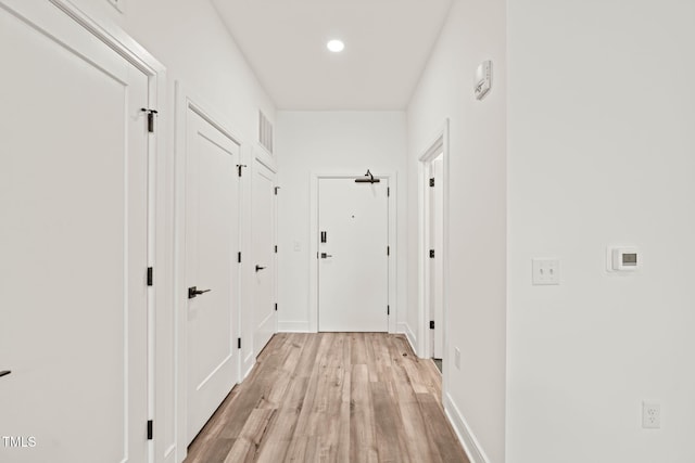 615 Daniels St Unit 215, Raleigh, NC 27605 - hall featuring light wood-style floors, recessed lighting, and baseboards