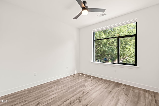 615 Daniels St Unit 215, Raleigh, NC 27605 - spare room featuring light wood finished floors, baseboards, and ceiling fan