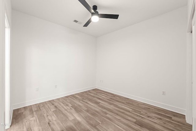 615 Daniels St Unit 215, Raleigh, NC 27605 - spare room with wood finished floors, ceiling fan, and baseboards