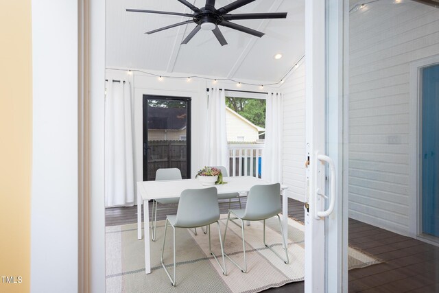dining space with wood finished floors and a ceiling fan