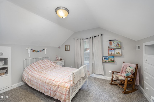carpeted bedroom with lofted ceiling and baseboards