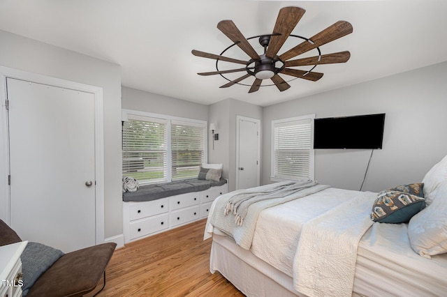 bedroom with light wood-style flooring and ceiling fan