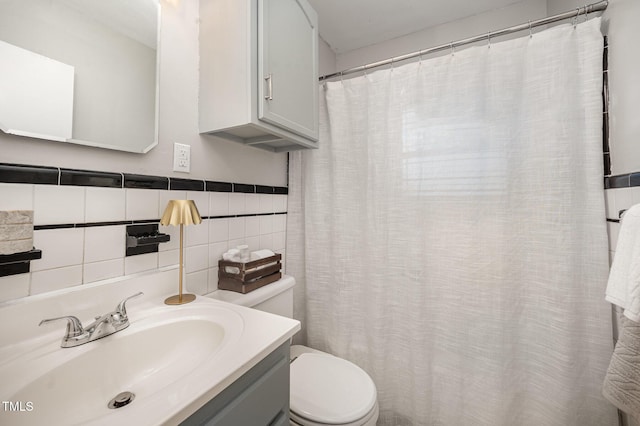 full bathroom with toilet, vanity, and a shower with curtain
