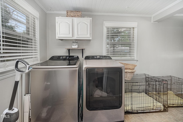 laundry room with independent washer and dryer, ornamental molding, and cabinet space