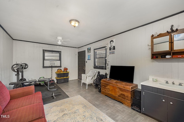 living area featuring ceiling fan and cooling unit