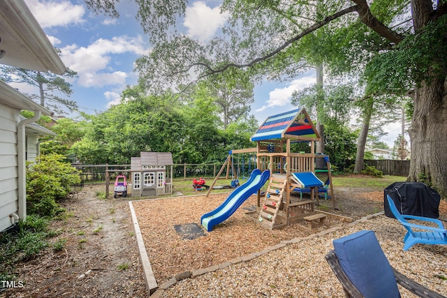 view of playground with a fenced backyard