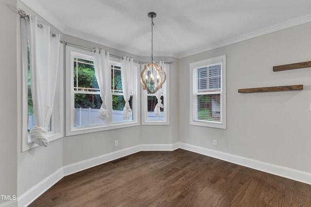 unfurnished dining area with a chandelier, baseboards, dark wood-type flooring, and crown molding