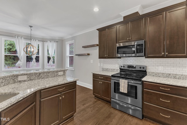 kitchen with stainless steel appliances, crown molding, healthy amount of natural light, and backsplash