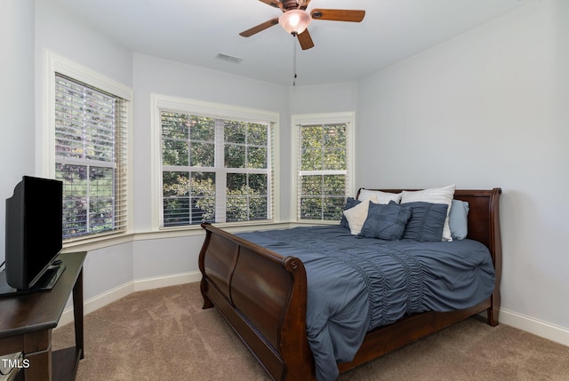 bedroom featuring carpet, baseboards, and a ceiling fan