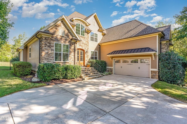 view of front facade featuring stone siding, driveway, fence, an attached garage, and roof with shingles