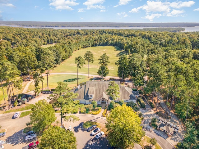 aerial view of a forest and a local golf course
