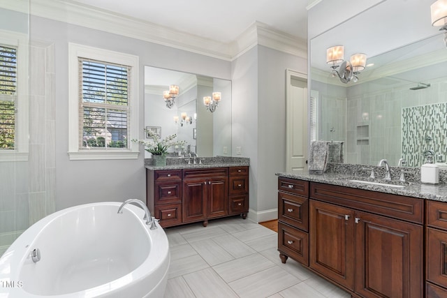 bathroom featuring a chandelier, a walk in shower, a freestanding bath, and two vanities