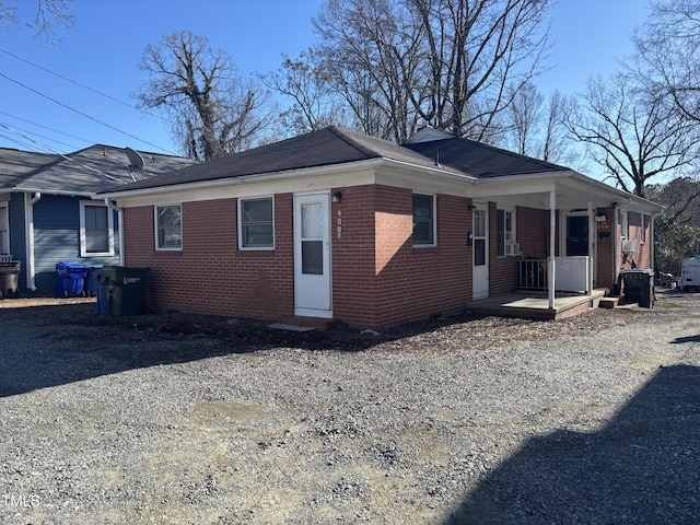 208 E Geer St, Durham, NC 27701 - view of side of property featuring brick siding and covered porch