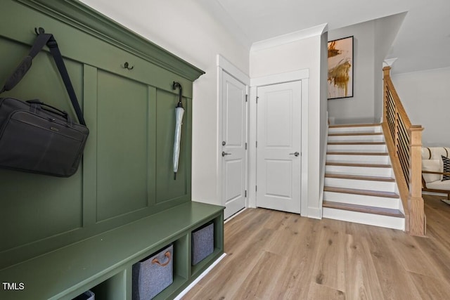 4611 Mint Leaf Ln, Raleigh, NC 27612 - mudroom with light wood-type flooring and ornamental molding