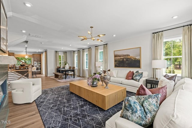4611 Mint Leaf Ln, Raleigh, NC 27612 - living room with dark wood-style flooring, healthy amount of natural light, a chandelier, and recessed lighting